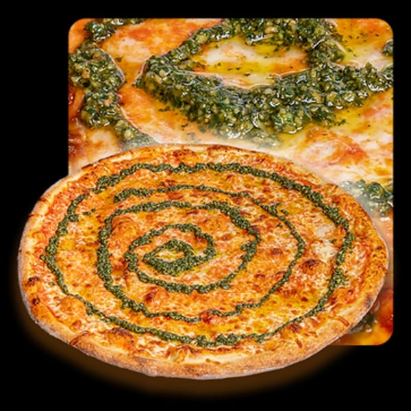 Golden Lizzard Pizza's pesto swirl pizza with melted cheese and tomato sauce.