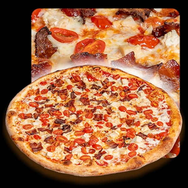 Golden Lizzard Pizza's chicken, bacon, and tomato pizza with a cheesy white sauce.