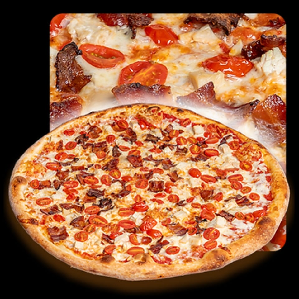Golden Lizzard Pizza's chicken, bacon, and tomato pizza with a cheesy white sauce.